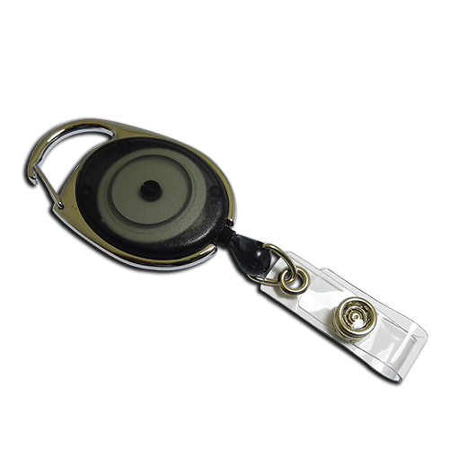 A retractable badge reel with a clear plastic clip, gold-toned metal hardware, and a black and gray retractable cord, shown on a solid white background.