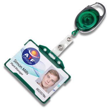 A retractable badge reel with a green and silver metal body, attached to a white plastic clip and a sample ID badge card. The reel is shown on a clean white background.