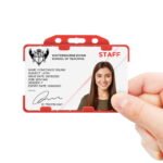 Red double sided landscape ID card holder on a transparent background being held